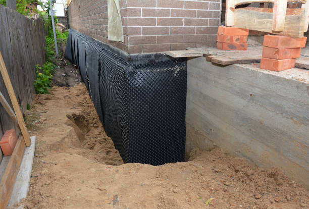 Happy homeowners after waterproofing job in McDonough